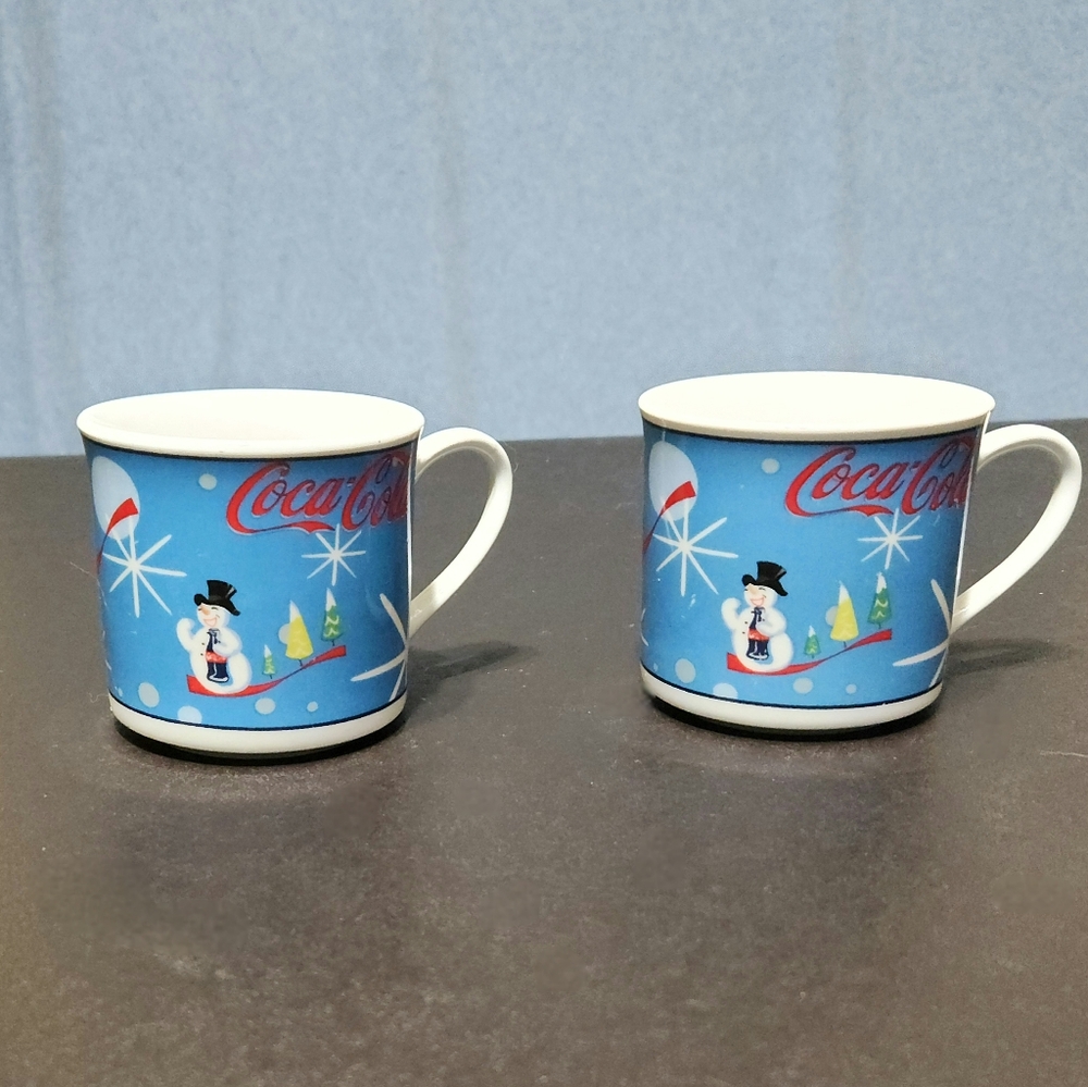 Coca Cola Co. set of two Laughing Snowman mugs